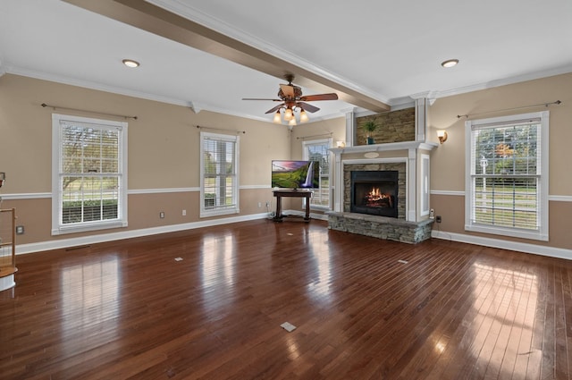 unfurnished living room featuring ceiling fan, hardwood / wood-style flooring, ornamental molding, and a fireplace