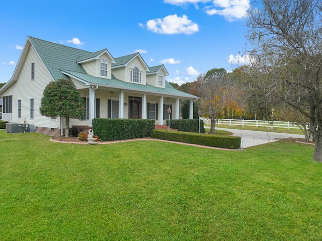 view of front facade with covered porch and a front yard