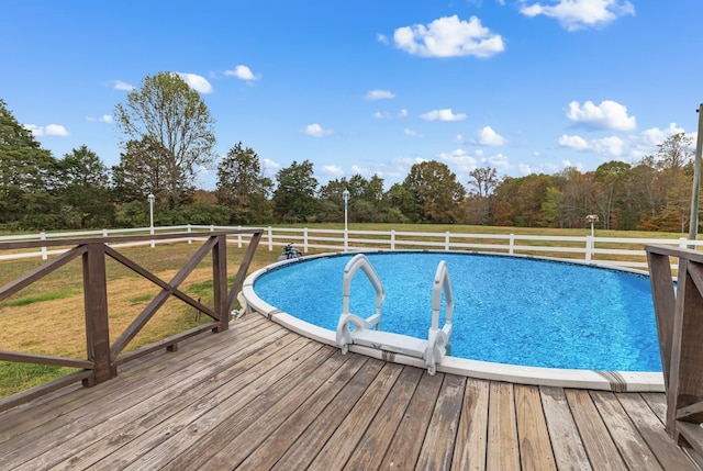 view of swimming pool featuring a wooden deck