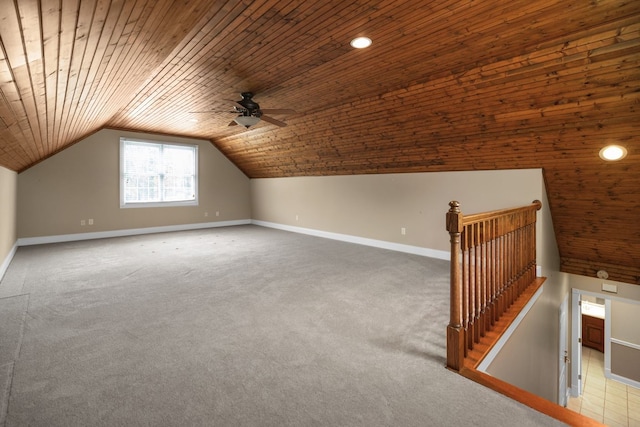 bonus room featuring vaulted ceiling, ceiling fan, carpet flooring, and wooden ceiling