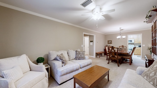 carpeted living room with ornamental molding and ceiling fan with notable chandelier