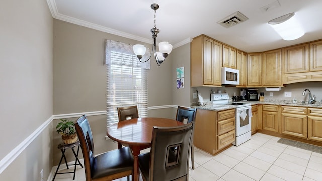 kitchen with white appliances, sink, hanging light fixtures, ornamental molding, and a chandelier