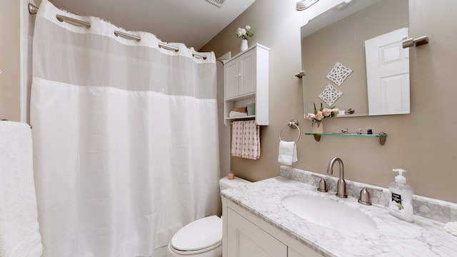 bathroom with vanity, toilet, and a shower with curtain