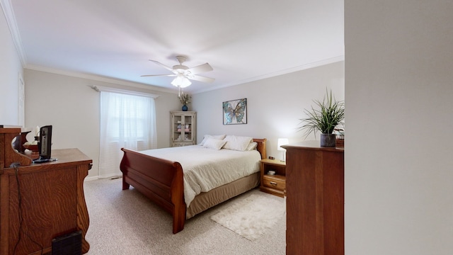 bedroom with crown molding, light colored carpet, and ceiling fan