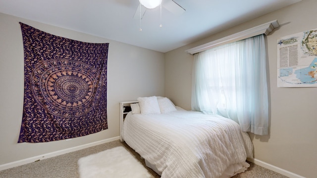 bedroom featuring ceiling fan and light colored carpet