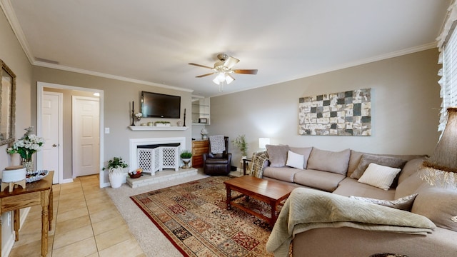 living room with crown molding, ceiling fan, and light tile patterned floors