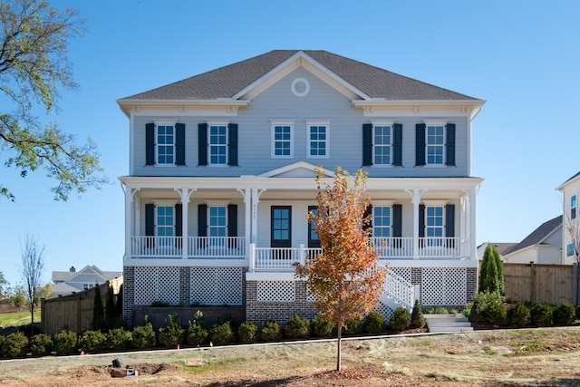 colonial house featuring covered porch