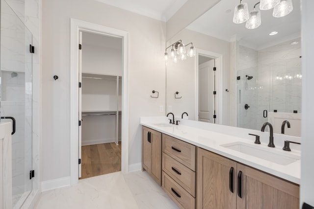 bathroom with vanity, ornamental molding, and walk in shower