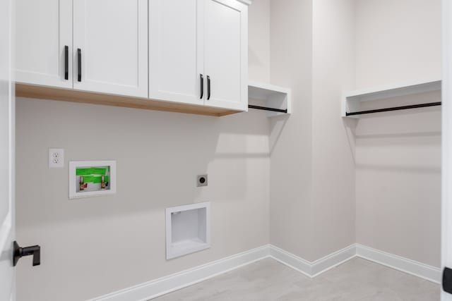 washroom featuring hookup for an electric dryer, washer hookup, and cabinets