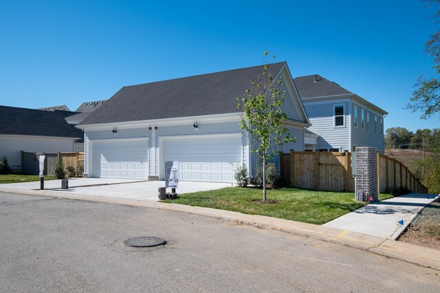 exterior space featuring a front yard and a garage