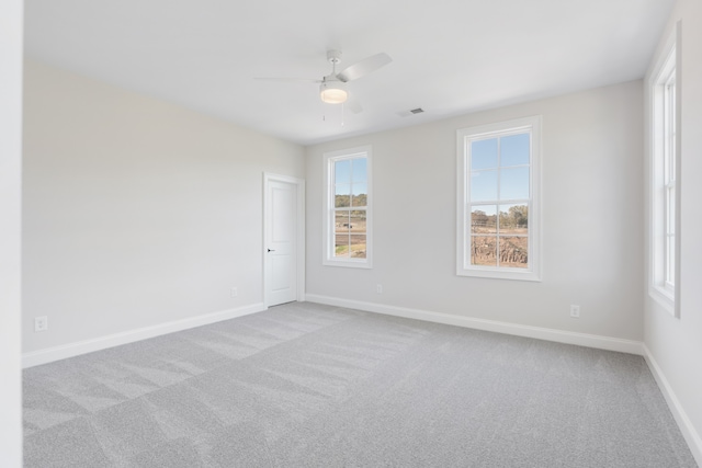 carpeted empty room with ceiling fan