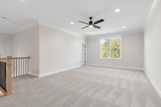 carpeted empty room with ornamental molding and ceiling fan