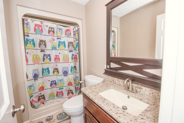 full bathroom featuring vanity, toilet, and shower / bath combo with shower curtain