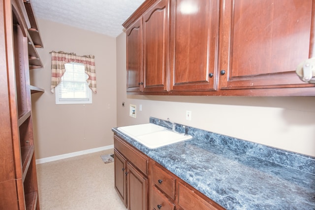 bathroom featuring vanity and a textured ceiling