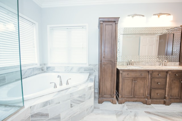 bathroom featuring vanity, crown molding, and tiled bath