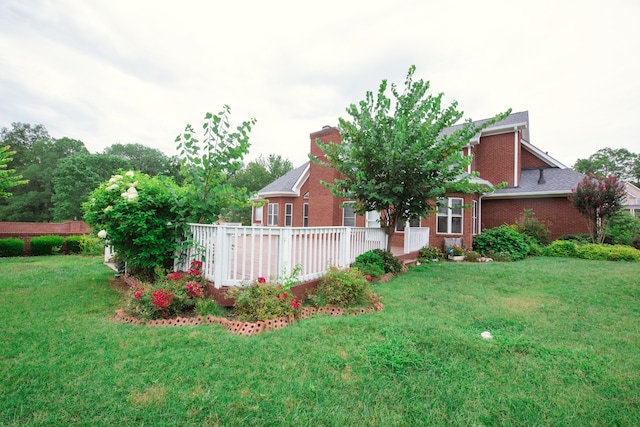 view of yard featuring a wooden deck