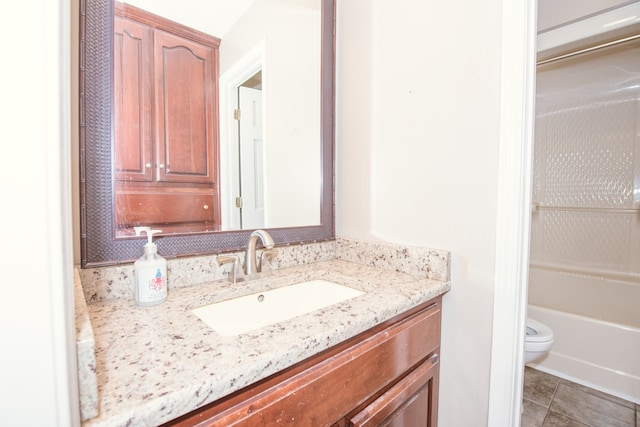 full bathroom featuring vanity, toilet, tile patterned floors, and separate shower and tub