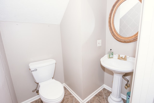 bathroom featuring toilet and tile patterned floors