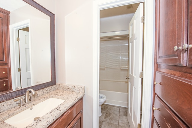 bathroom with vanity, toilet, and tile patterned floors