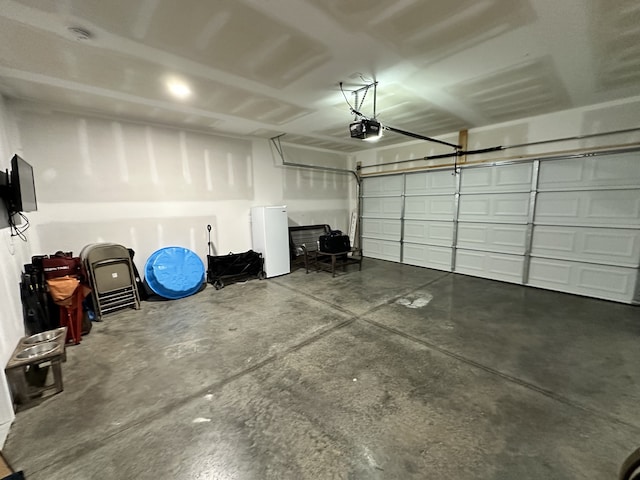 garage featuring a garage door opener