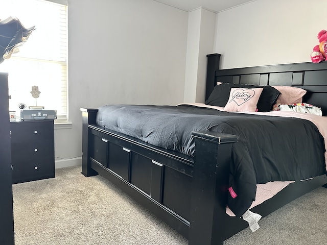 bedroom featuring light colored carpet