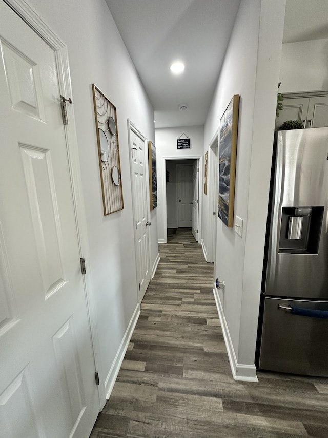 corridor featuring dark wood-type flooring