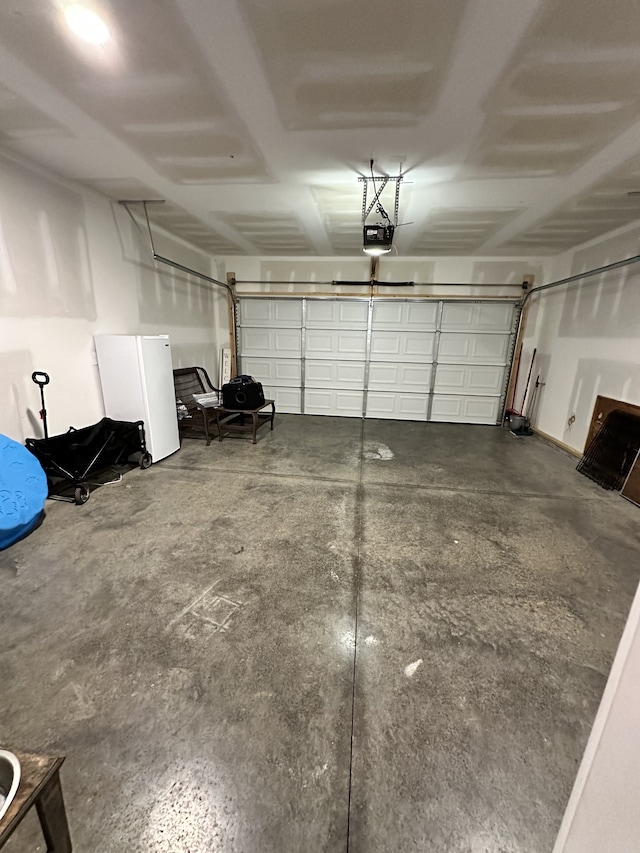 garage featuring a garage door opener