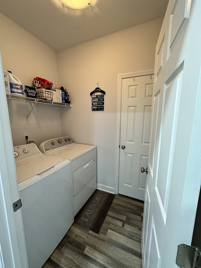 laundry room with dark wood-type flooring and independent washer and dryer