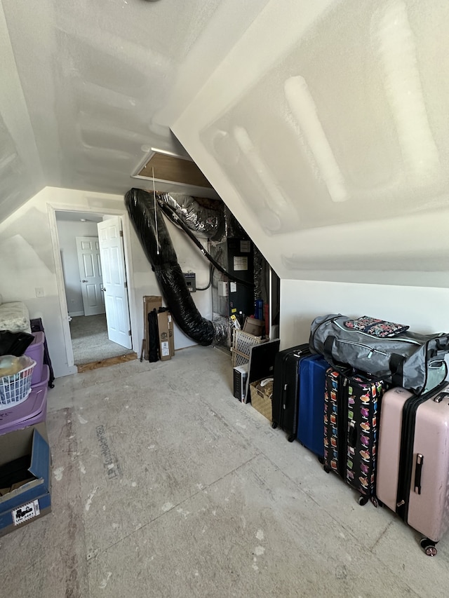 additional living space featuring lofted ceiling