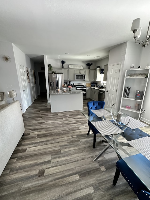 dining area with dark wood-type flooring and sink