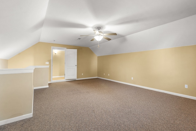 additional living space with carpet, vaulted ceiling, and ceiling fan