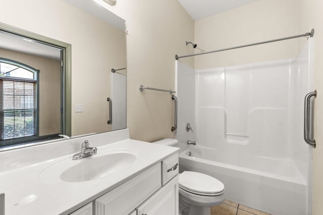 full bathroom with vanity, toilet, tile patterned floors, and washtub / shower combination