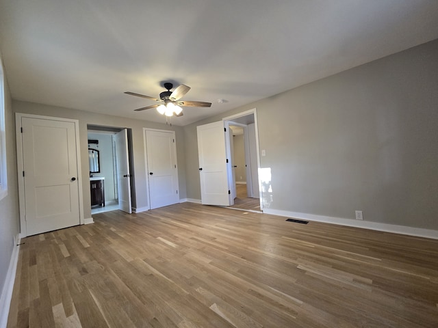 unfurnished room with light hardwood / wood-style floors and ceiling fan