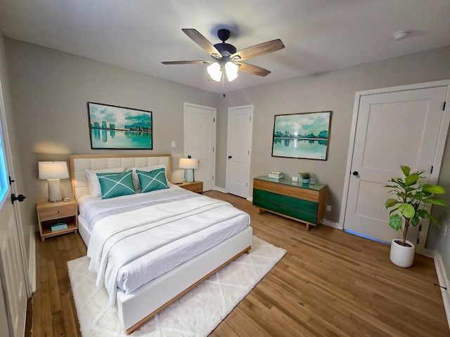 bedroom featuring ceiling fan and wood-type flooring