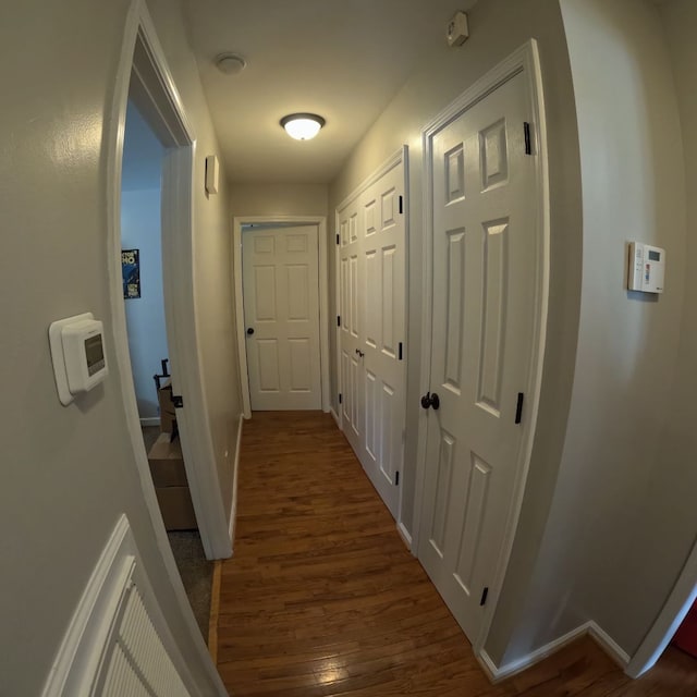 hall featuring dark wood-type flooring