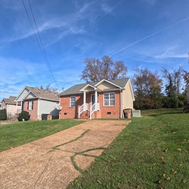 bungalow-style house with cooling unit and a front yard