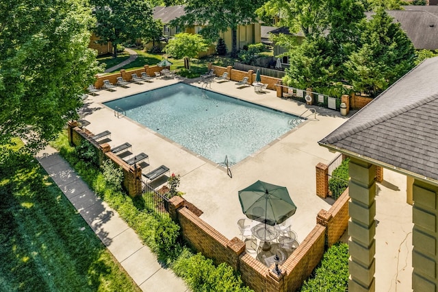 view of swimming pool with a patio