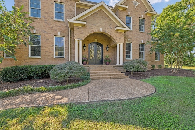 2971 Spanntown Rd, Arrington, TN 37014 - view of front of property with french doors, brick siding, and a front lawn
