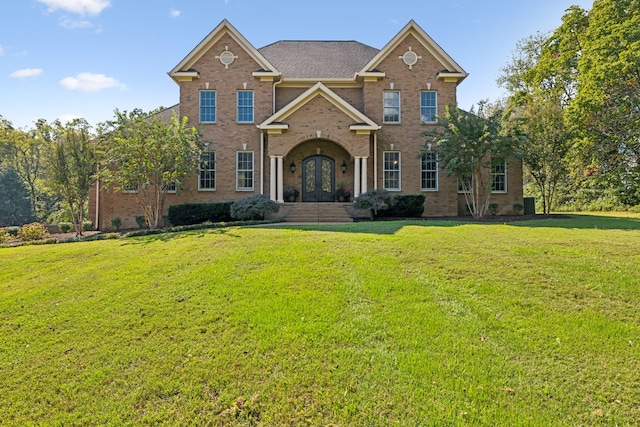 view of front of property with french doors and a front yard