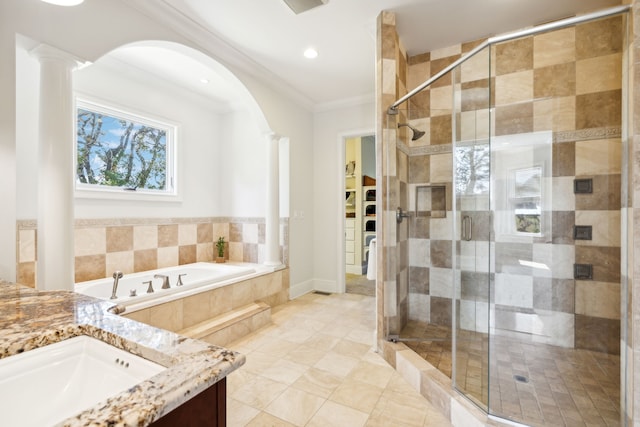 bathroom with vanity, crown molding, decorative columns, and separate shower and tub