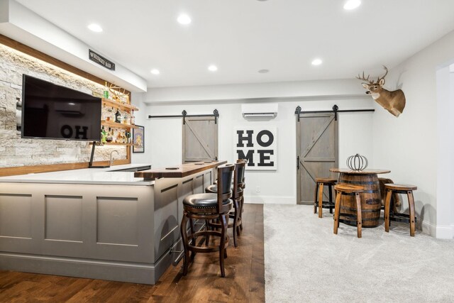 2971 Spanntown Rd, Arrington, TN 37014 - indoor dry bar featuring a barn door, a wall mounted air conditioner, recessed lighting, and baseboards