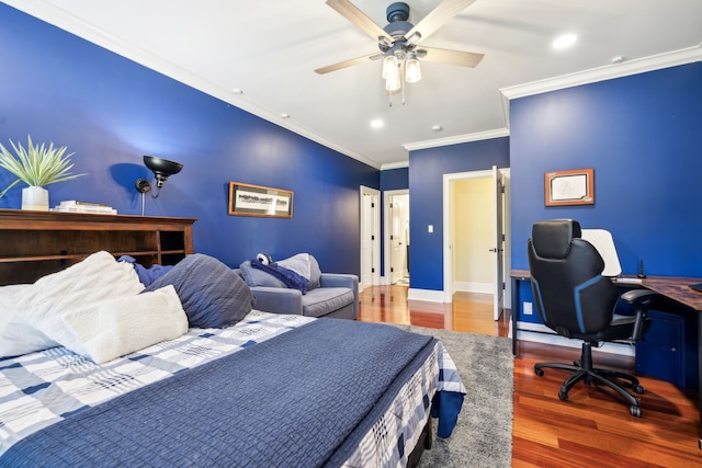 bedroom with hardwood / wood-style flooring, ornamental molding, and ceiling fan