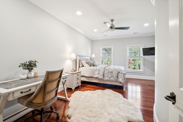 bedroom with crown molding, dark hardwood / wood-style floors, and ceiling fan