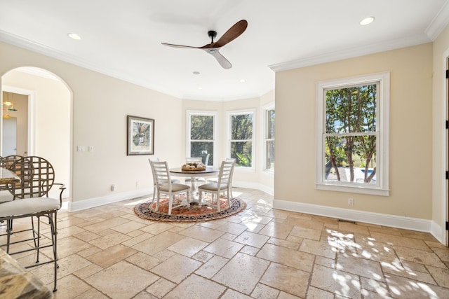 dining area featuring crown molding and ceiling fan