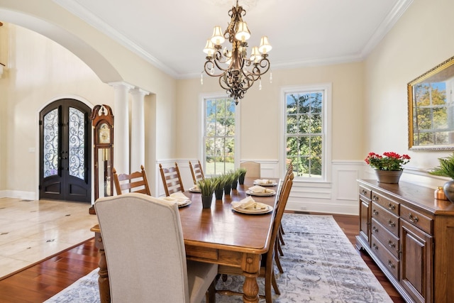 2971 Spanntown Rd, Arrington, TN 37014 - dining space featuring arched walkways, french doors, ornate columns, a chandelier, and crown molding