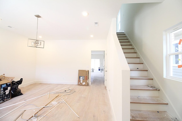 staircase featuring hardwood / wood-style floors