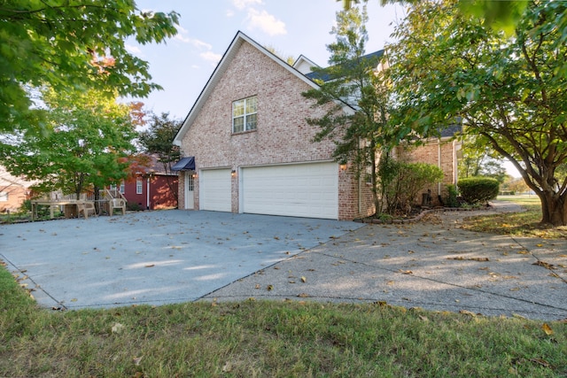 view of side of home with a garage