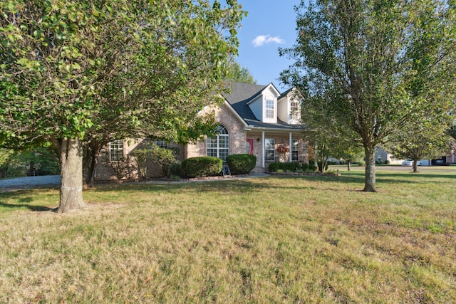 new england style home with a front yard