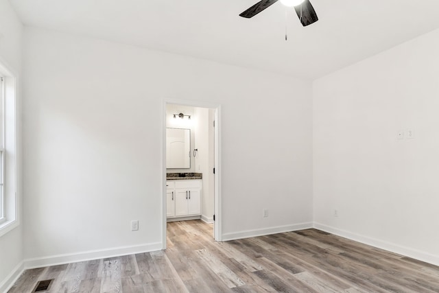 unfurnished room with light hardwood / wood-style floors and ceiling fan