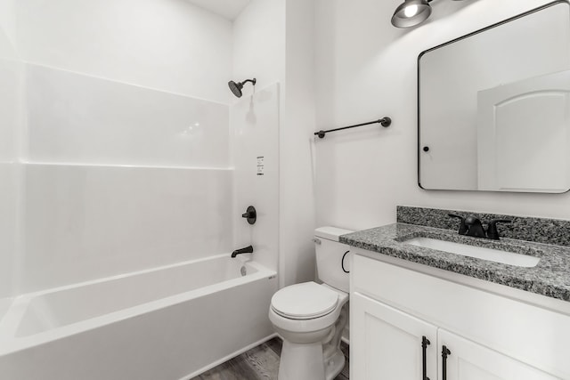 full bathroom with vanity, toilet, bathtub / shower combination, and wood-type flooring